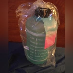 Gallon jugs 3 different colors pink blue and pink/purple.